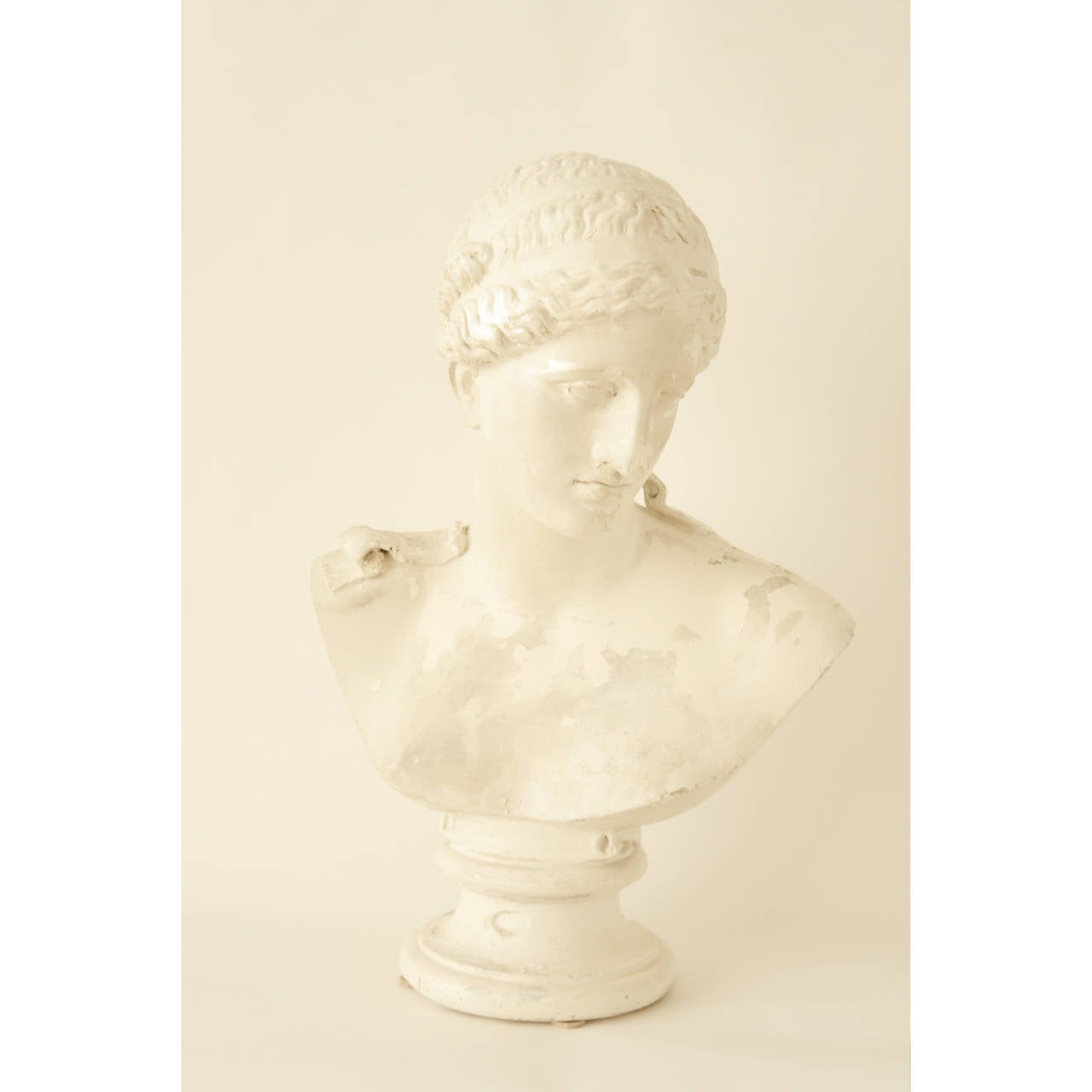 Early 20th Century Cast Plaster Bust of a Greco-Roman Style Woman, Based on an Earlier Statue. Distressed aesthetic.