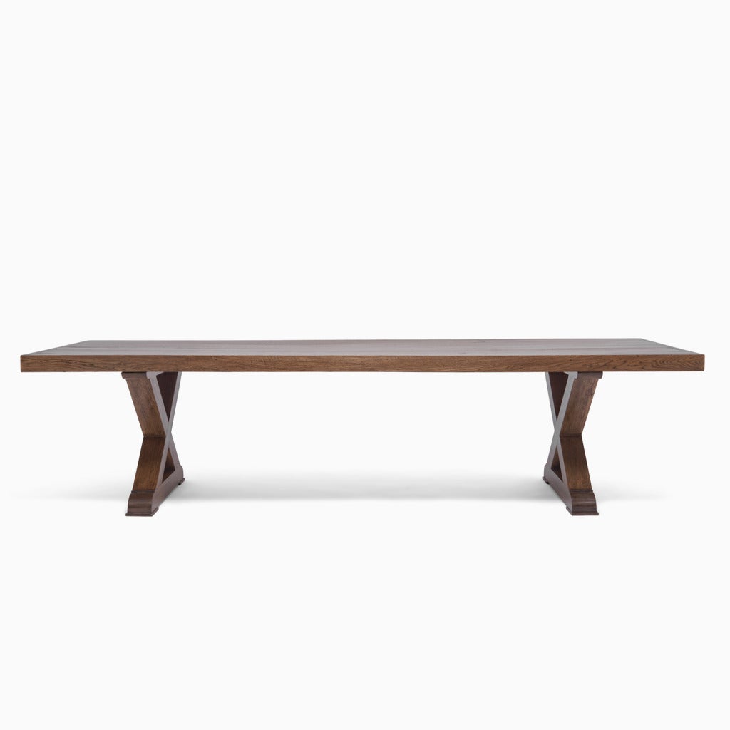 The Normandy Dining Table With a Thick Rectangular Antique Wood Top Raised on a Contemporary X-Shaped Base with Trestle Legs. (This Table as well as all Demiurge tables are made to order and are completely customizable.)