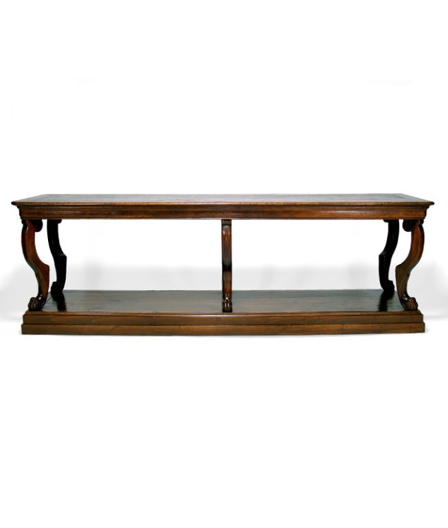 A Elegant 19th Century French Walnut and Oak Drapers Table with Paw Feet.