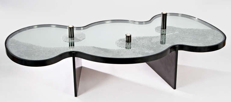 Interactive table with steel ball bearings under glass top which can be arranged using magnets (candlesticks or large steel balls).

Limited edition of 8.
Signed and numbered.
2012.

Hubert Le Gall's work is a bold combination of sophisticated