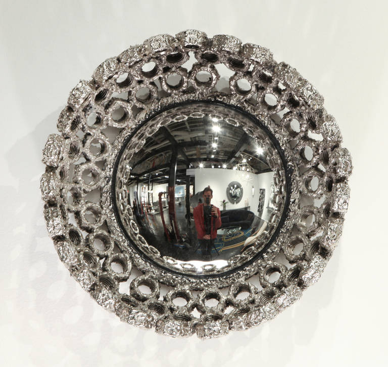 Chrome patinated steel bolted mirror within Laurent Chauvat's collection inspired by industry and shipwrecks.

Unique piece,
2014.