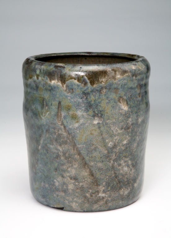 Evoking thoughts of rocky mountains and stormy skies, Beyer's compelling blue, gray, and gold vase resembles natural azurite. The irregular shape and dripping glazes, inspired by Japanese sources, express a reverence for nature and its accidental