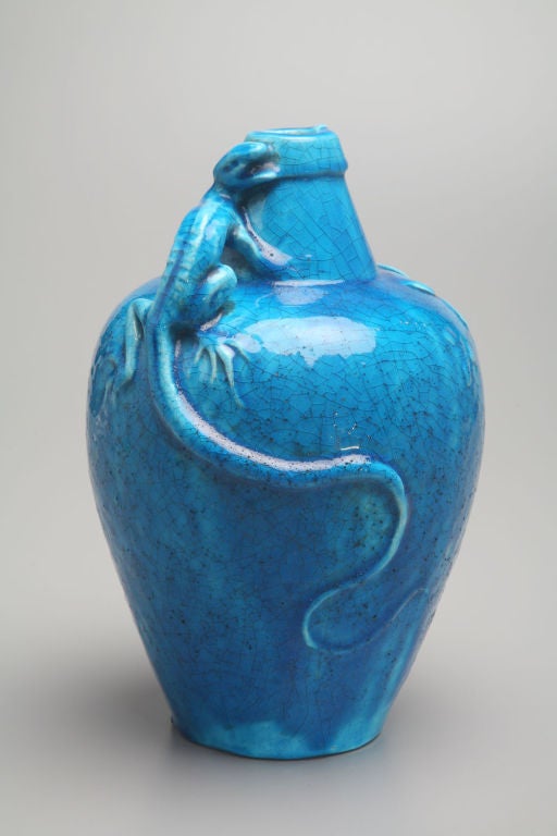 This baluster-shaped eartheware vase is glazed in a deep turquoise color that was sometimes called 