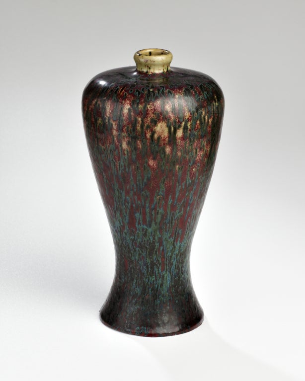 This vase is a classical Chinese form that exhibits a sumptuous range of blue greens and sang de boeuf. It is a perfect homage to the ancient art tradition of the East.