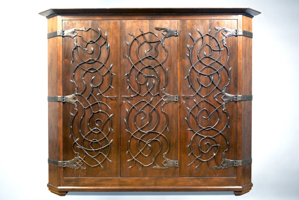 The design of this large cabinet by Richard Riemerschmid is typical of early Munich Jugendstil. The cabinetâ??s simple construction and massive dimensions, combined with the hand-wrought iron fittings, recall a medieval spirit, characteristic also