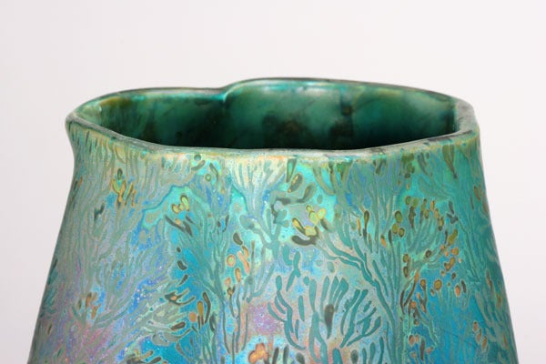 Photography cannot do justice to the complexity of the glaze on this remarkable ceramic masterpiece. The luster varies from 'Persian' turquoise to pink, red, green, gold, and every tone in between. An active world of shrimp, seaweed, and other sea