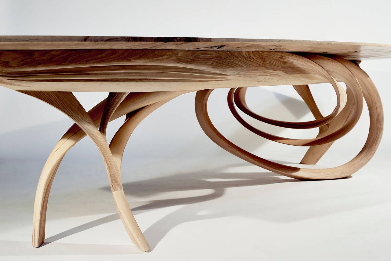 Joseph Walsh’s signature woodworking technique is based on a principle to allow pieces to evolve and grow, rather than adhere to specific predetermined forms. In the Enignum series, Walsh strips wood into thin layers, manipulating and reconstructing