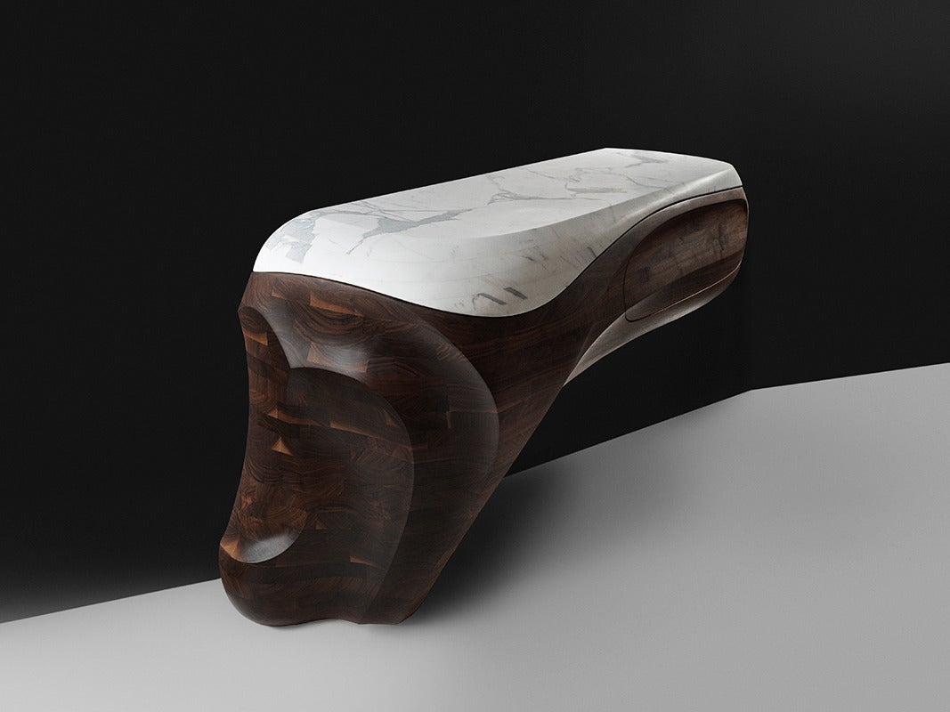 At once a sublime work of art and a functional object, bang is a unique, hand-carved console that defies easy categorization. Markus Haase’s two decades of experience as a sculptor are evident in his masterful treatment of materials, where smooth
