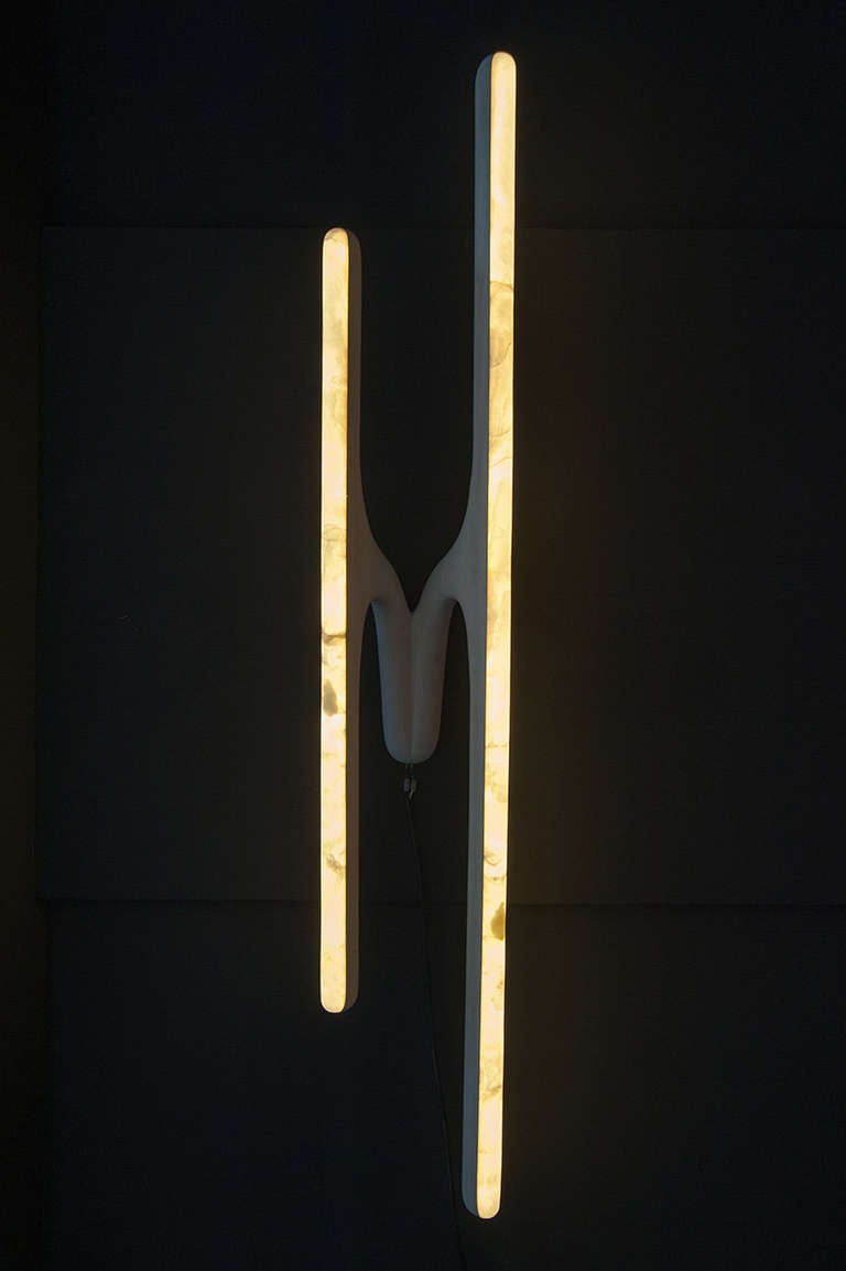 Markus Haase unique hand-sculpted sconce in bleached ash and onyx (as shown). Wood and stone can be custom ordered – alabaster or marble. Size can also be custom ordered.

LED light glows softly through the stone. The ash is in soft natural finish