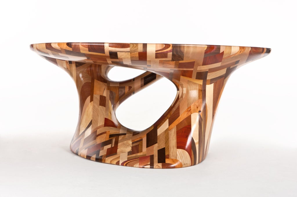Combining the highly accomplished technical design of Cairn Young with the master craftsmanship of Ian Spencer, Yard Sale Project produces one-of-a-kind, exquisite pieces of furniture. Young and Spencer's “Palombaggia" table challenges the