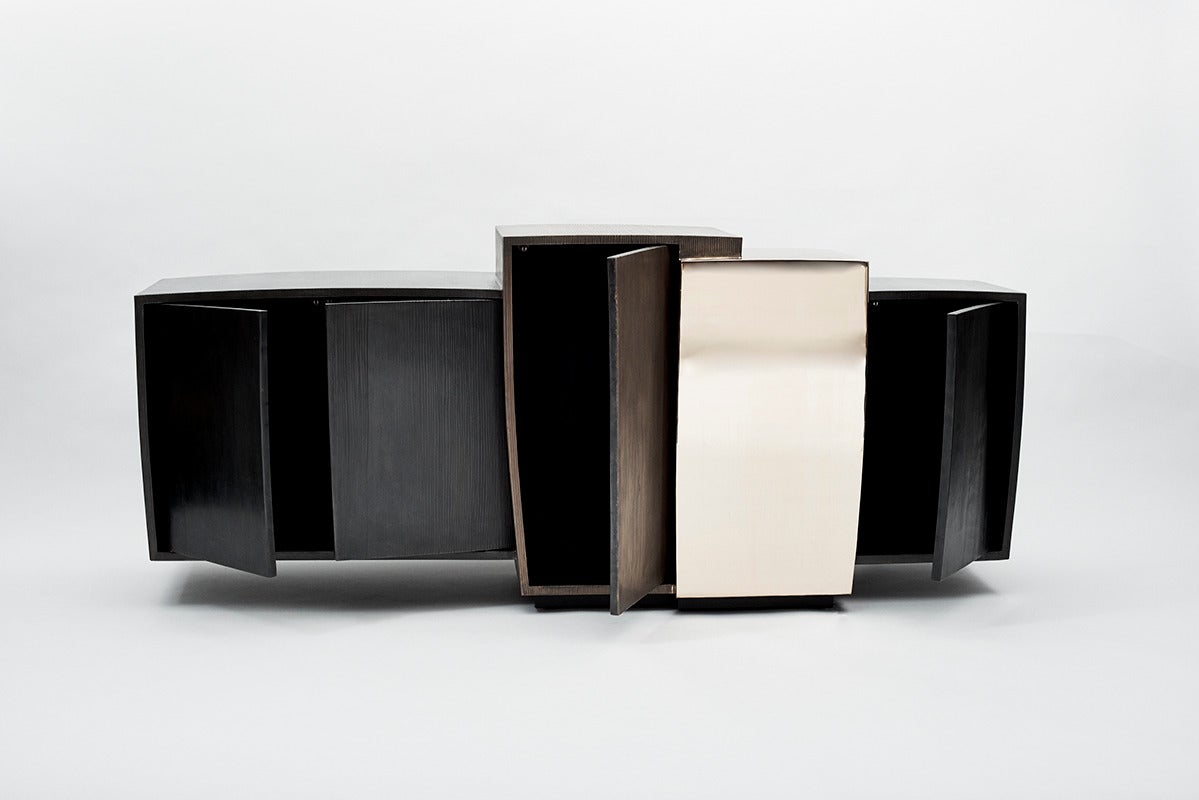 Gary Magakis blackened steel, mirror-polished bronze and textured patinated bronze epitomizes the sculptor’s distinct approach to creating bold and dense geometric forms that simultaneously exude an elegant, buoyant aesthetic of Modernism. At once a