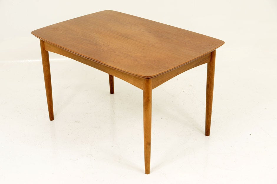 Designed in 1955, this is a teak dining set by the design duo of Nils and Eva Koppel. Although not prolific designers, one can see the high quality of crftsmanship in this set. Set consists of teak and oak dining table with pull out extensions and 6