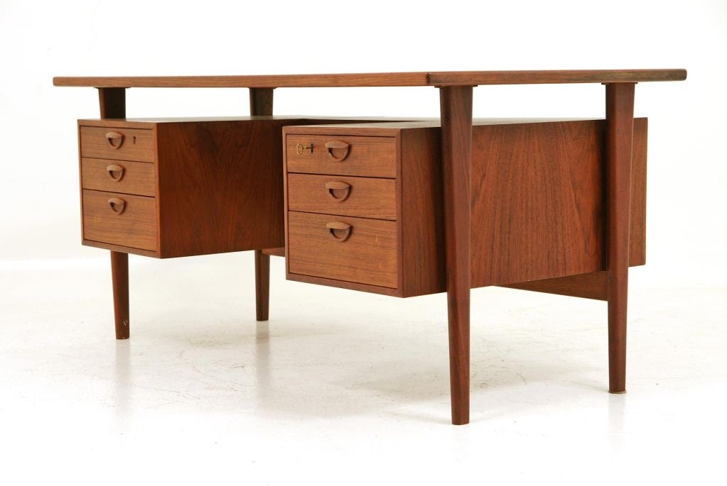 Marvelous teak desk designed in the late 50's by Kai Kristiansen. Displaying Kristiansen's signature drawer pull design, this desk is completely original and in great condition.