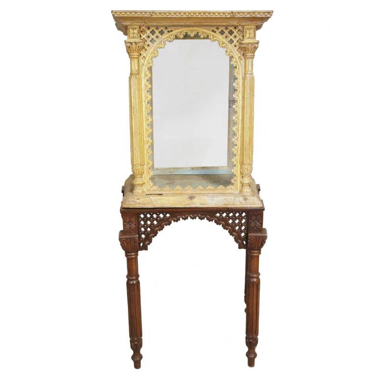 From a church in Goa, India, this intricately fashioned shrine is carved with pierced detail, dentil moulding on the cornice top and arched windows. This charming, gilt piece makes a wonderful display case. The custom, crafted Indian rosewood base