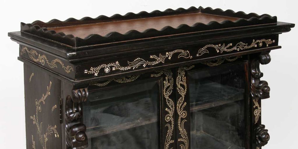 Catering to the tastes of Europeans traveling on the route between Calcutta and Delhi, the remarkable artisans of Monghyr (Munger) created small furniture pieces of rare ebony, intricately inlaid with ivory tracery; the finest of artistry. This is a