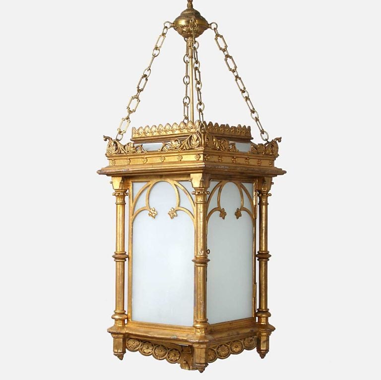 Of rOf rectangular form with old or original gold paint, with a low hipped roof and shell gallery, the top of each corner with winding oak branches and leaves over a freestanding column. Each side is accented with trefoil fretwork on a frosted white