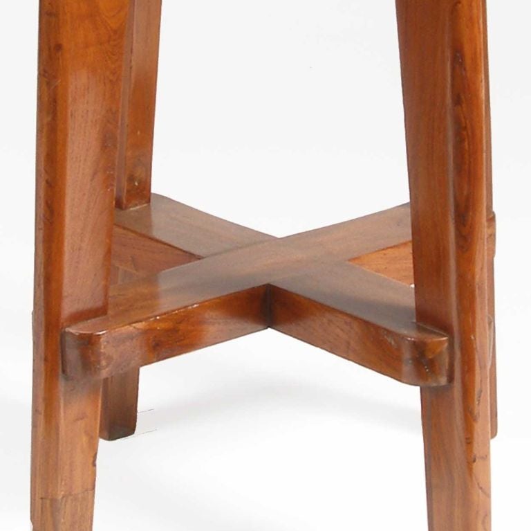 Pierre Jeanneret (Swiss, 1896-1967)<br />
Crafted of solid teak with a round caned seat supported on four tapered legs joined by an X-stretcher.<br />
<br />
Literature: E. Touchaleaume & G. Moreau, Le Corbusier Pierre Jeanneret: The Indian