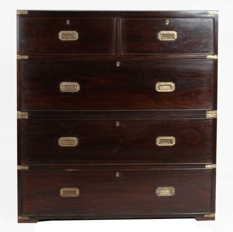 Hand fashioned in two parts, this two-over-three-drawer chest was made for military transport, with heavy, hand forged iron handles on each end. It features inset brass bail handles. Notice the very beautiful rosewood, nicely highlighted by the