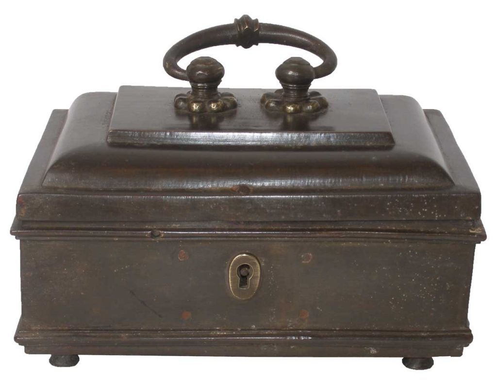 This box was crafted with a raised lid that holds a stout and decorative, swing bail. It opens to reveal a second, covered compartment within the body of the piece. With original patina, it would polish nicely for a more modern look as well.