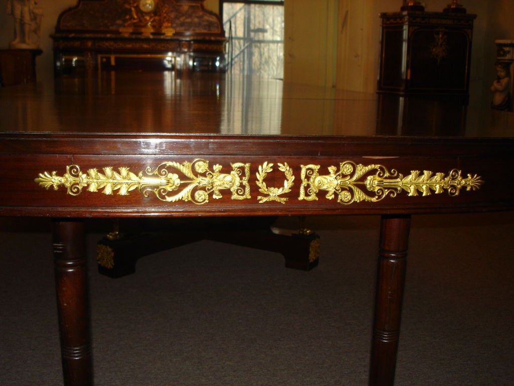 French An Important late 19th century gilt bronze-mounted Empire style dining table