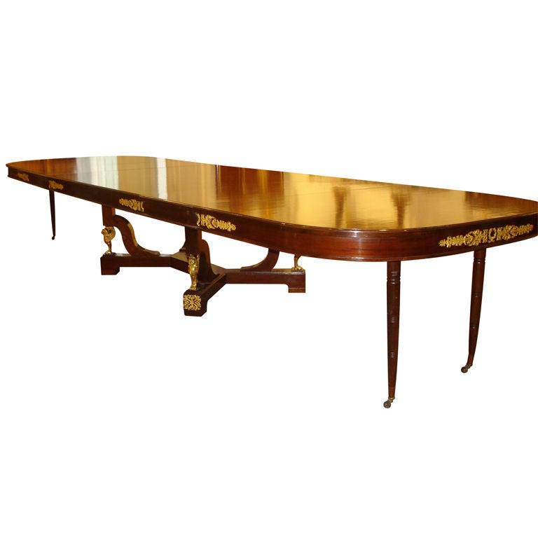 An Important late 19th century gilt bronze-mounted Empire style dining table