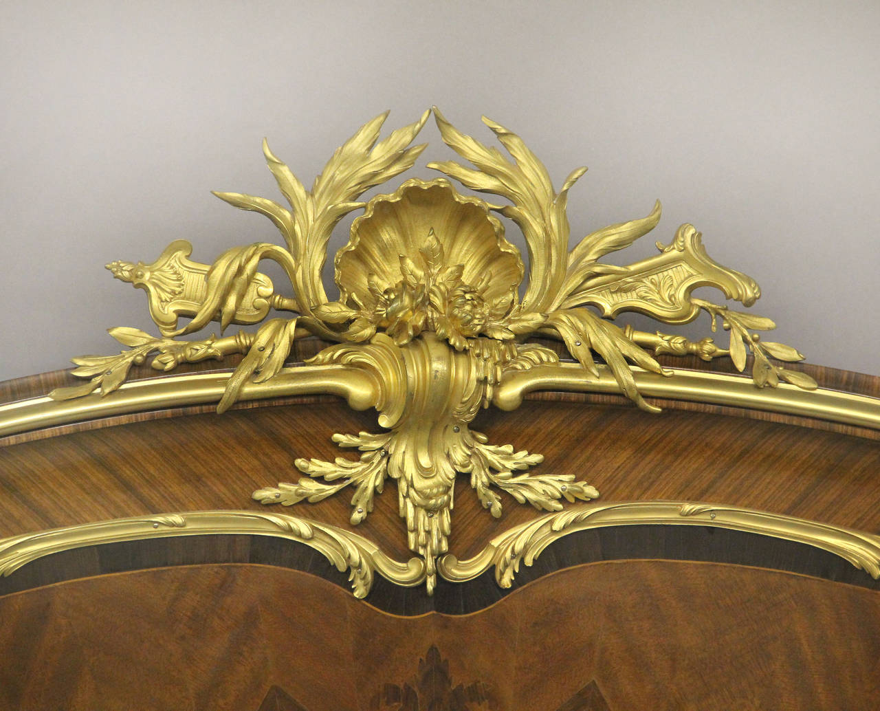 A Very Fine Late 19th / Early 20th Century Louis XV Style Gilt Bronze Mounted Inlaid Foliate Marquetry and Parquetry King Size Bed

By François Linke

The headboard and footboard centered by a large bronze mount of a scalloped shell and flower