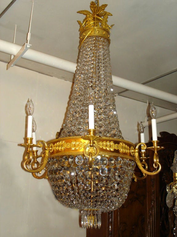 A beautiful late 19th century gilt bronze and crystal 14 (8 inside) light basket chandelier.

If you are looking for a Chandelier, a lantern or sets of sconces, Charles Cheriff Galleries is the right place to come. We have over 300 Chandeliers in