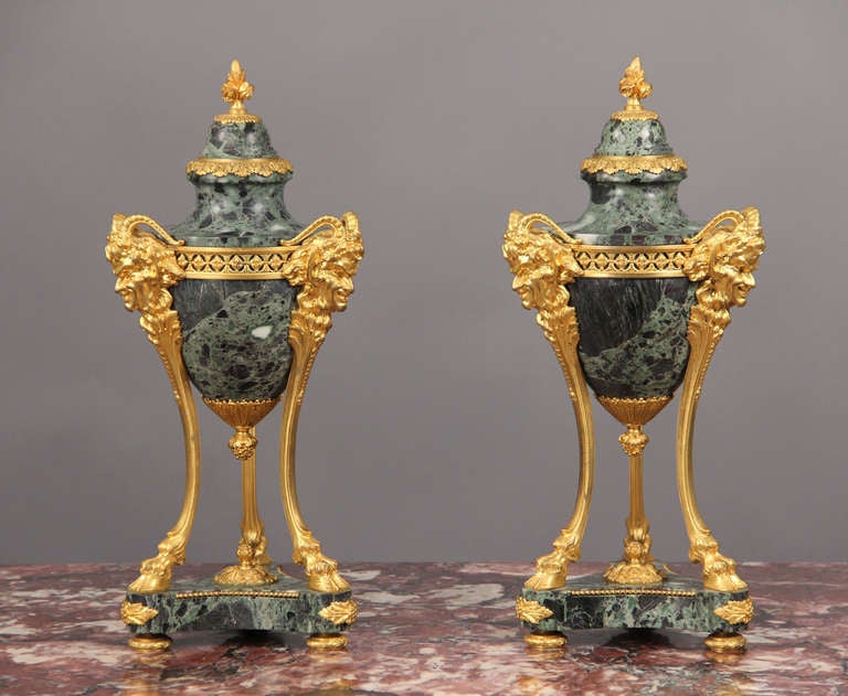 A pair of late 19th century Louis XVI bronze-mounted cassolettes

by Thiebaut Freres.

Each with ovoid marble body, three supports with satyr masks, on a circular matching marble base with turned feet.

Signed Thiebaut Freres Fondeurs, Paris