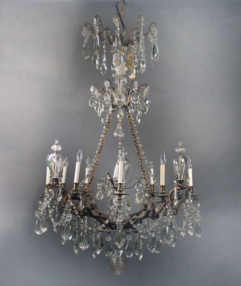  Late 19th Century Bronze and Crystal Ten Light Chandelier

Multi-faceted and size crystal including half pear shaped, three bottle finials and a cut crystal central column. 

If you are looking for a chandelier, a lantern or sets of sconces,