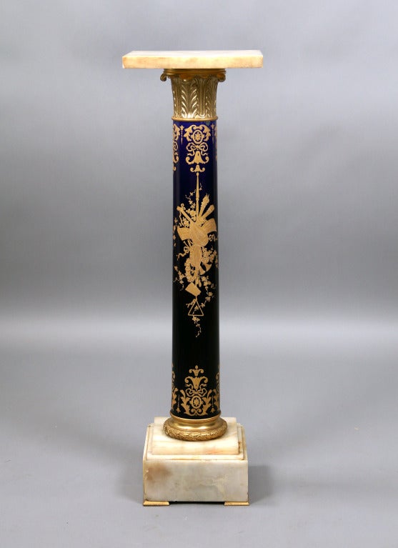 A Late 19th Century Gilt Bronze Mounted Onyx and Se`vres Style Pedestal

With square onyx top above columnar support painted with trophies.

In late 1739 - early 1740 the Se`vres Porcelain Factory opened in the Royal Cha^teau of Vincennes,