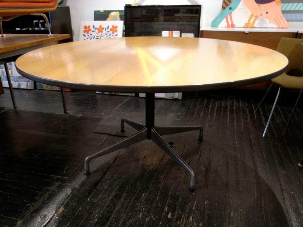 A great example of an Eames segmented base dining table with a rare combed oak top.