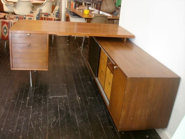 George Nelson Executive Desk and Return,  Herman Miller1948<br />
walnut top with 2 walnut drawers, 5 maple drawers and one sliding masonite door, 1 cabinet, 