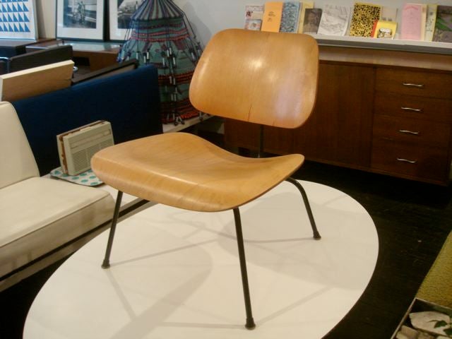 This is an early example of a very very faded red Eames LCM. Its hard to tell in the pictures but the chair is actually more of a pink color.