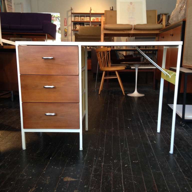 Steel Frame Desk designed by George Nelson for Herman Miller in 1952,
rare walnut front with yellow side and back.