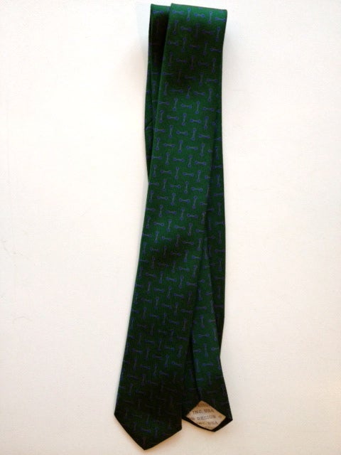 Rare necktie, designed by Alexander Girard for Herman Miller. Forest green with blue shapes.