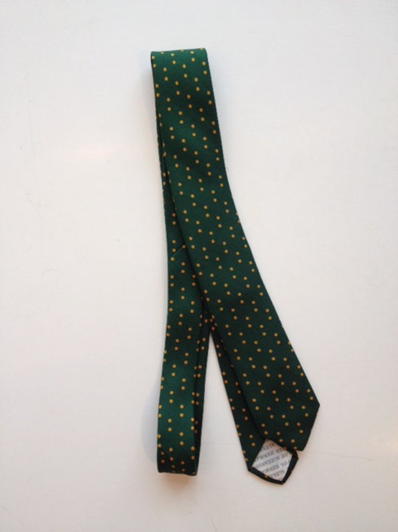 Rare necktie, designed by Alexander Girard for Herman Miller. Forest green with marigold dots.