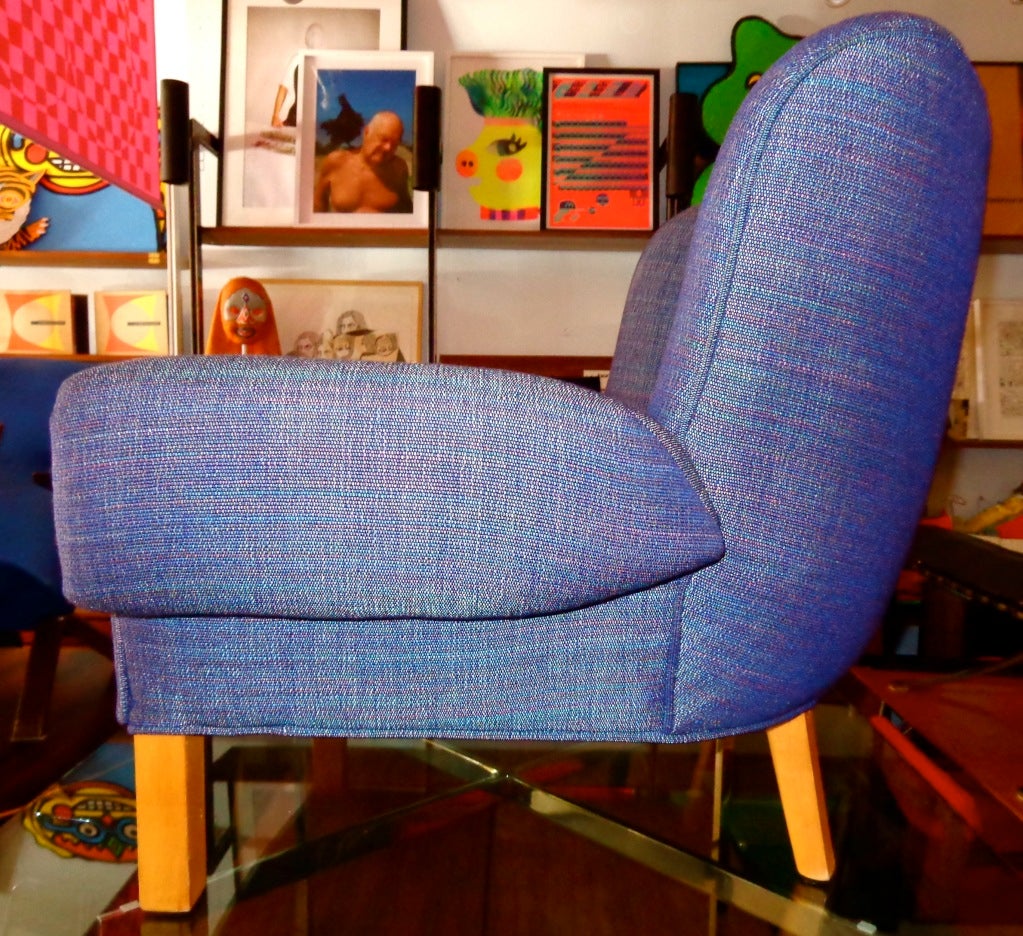 Armchair designed by Paul Laszlo for Herman Miller. With purple and blue upholstery fabric.