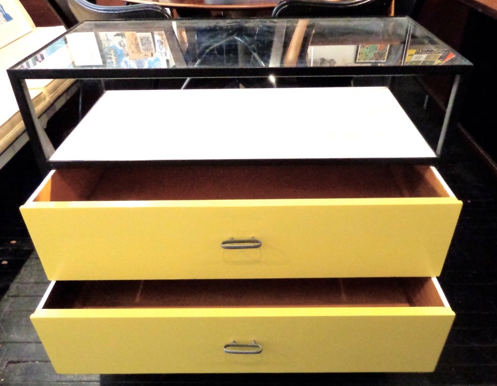 Sunny yellow and white two-drawer Steelframe chest with glass display case designed by George Nelson for Herman Miller. Original drawer pulls.