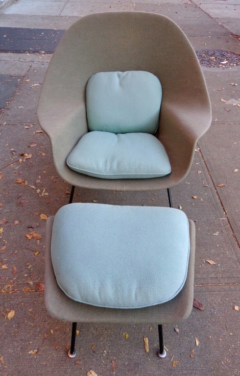 Womb chair and ottoman designed by Eero Saarinen for Knoll in 1946. Custom upholstry. Shell in 2 different colors of grey wool with light blue and sea-foam cushions.