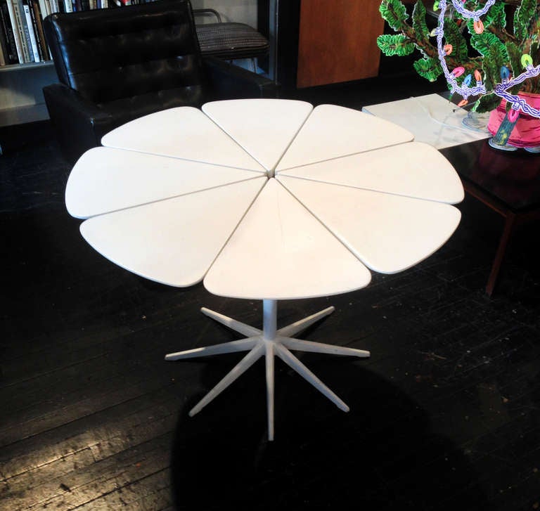 Eight Section Petal Dining Table designed by Richard Schultz in 1960 for Knoll. Redwood petal top currently lacquered white, with option to be stripped down. Metal base, white fused plastic finish. Table is suitable for indoor and outdoor use.