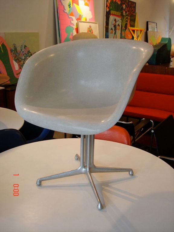 A rare Eames La Fonda arm chair from the first year of production when the base was hand welded.