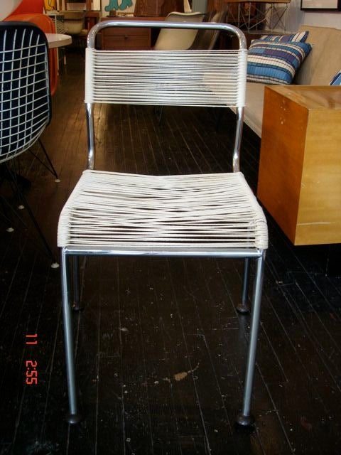 Rare set of dining chairs, polished crome frames with white cord seat and back.<br />
Andre Dupre was the french manufacturer of Bertoia chairs.