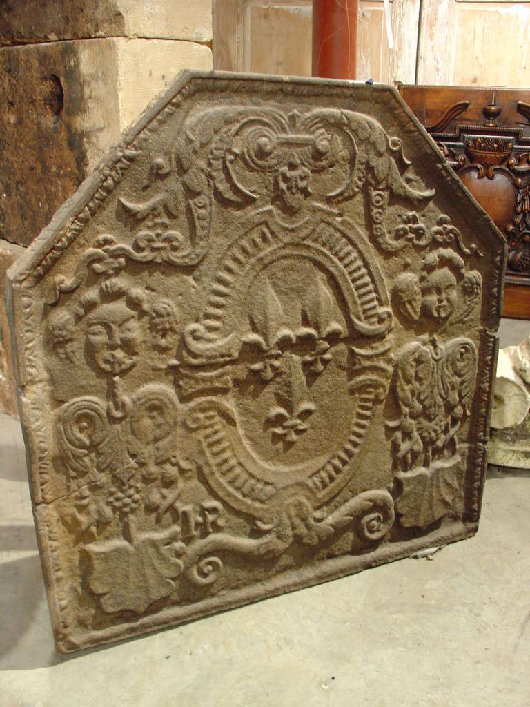 Originally, firebacks were used in fireplaces to radiate heat into the room. Now, in addition to use in fireplaces, they can also be used as ornamentation on stone walls, above stoves, or as an accessory. This particular fireback depicts a coat of