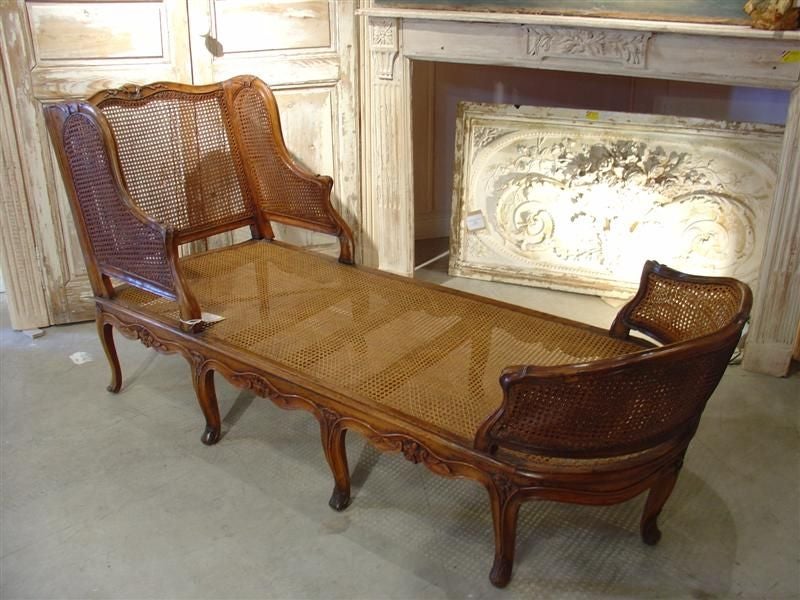 A Rare  French, Period Regence (1700-1730) Caned Chaise Longue with Nine Legs; Walnut Wood – Very Good Antique Condition ; replacement of caning to some areas as would be expected for its age. We believe it is from the Lorraine Region.

This