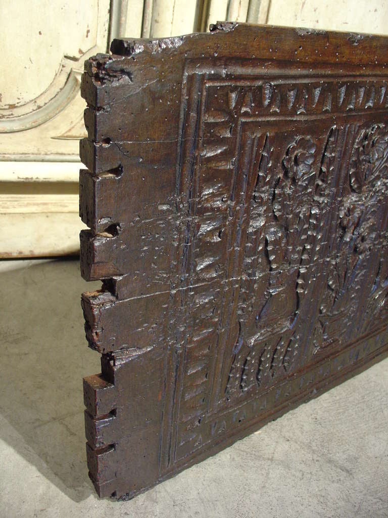 Antique Trunk Frontage from the 1600s with original lock; Normandy France

Dating to the 1600’s, the relief of the carvings has been worn over the centuries, yet still quite visible indicating the original carving was very deep throughout.  The