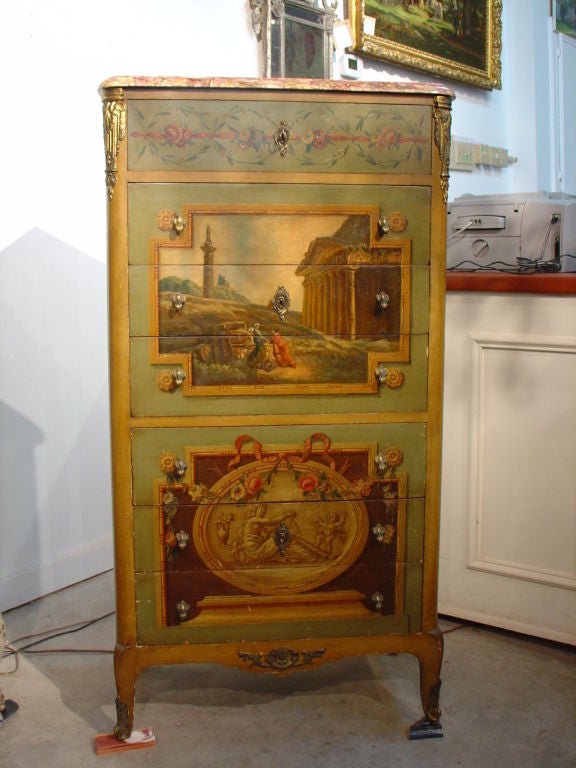 This painted antique French Semainier has painted scenes,  ormolu mounts on the front four corners and a marble top .  The front has seven drawers of equal size for lingerie, one drawer for each day of the week.  The front of the top drawer has a