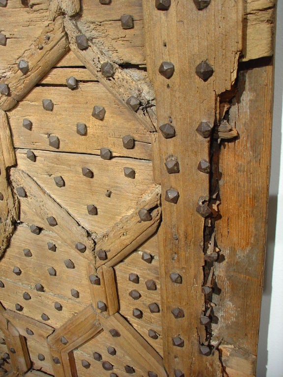 From Seville, this magnificent door’s geometric ornamentation exhibits the Moorish influence.  The Moors’ religion prohibited the use of the human figure in architectural decorations;  so, in their desire to attain beauty of ornament, they chose