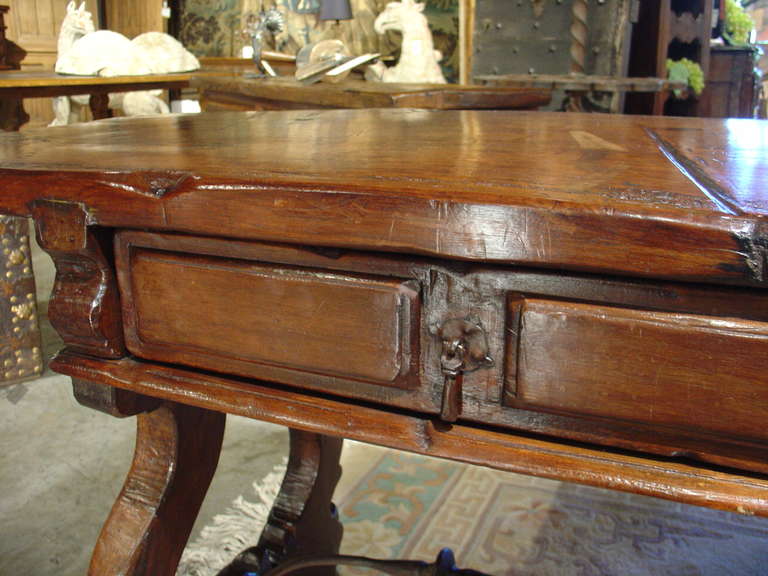 Catalonia, 1600s

This rare and superb Catalan Style table is from the 1600's. The walnut wood edges on the top are rounded with age and have old indentations and nicks which add even more to its appeal. This wonderful table has two drawers in the
