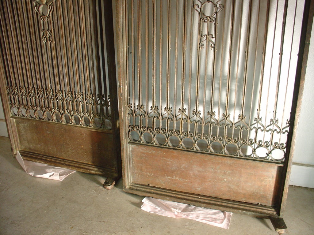 This is a pair of cast iron antique elevator gates from France dating to around the turn of the 20th century. These versatile antique elevator gates have a variety of uses in today’s interior design projects. 

Besides their original purpose as