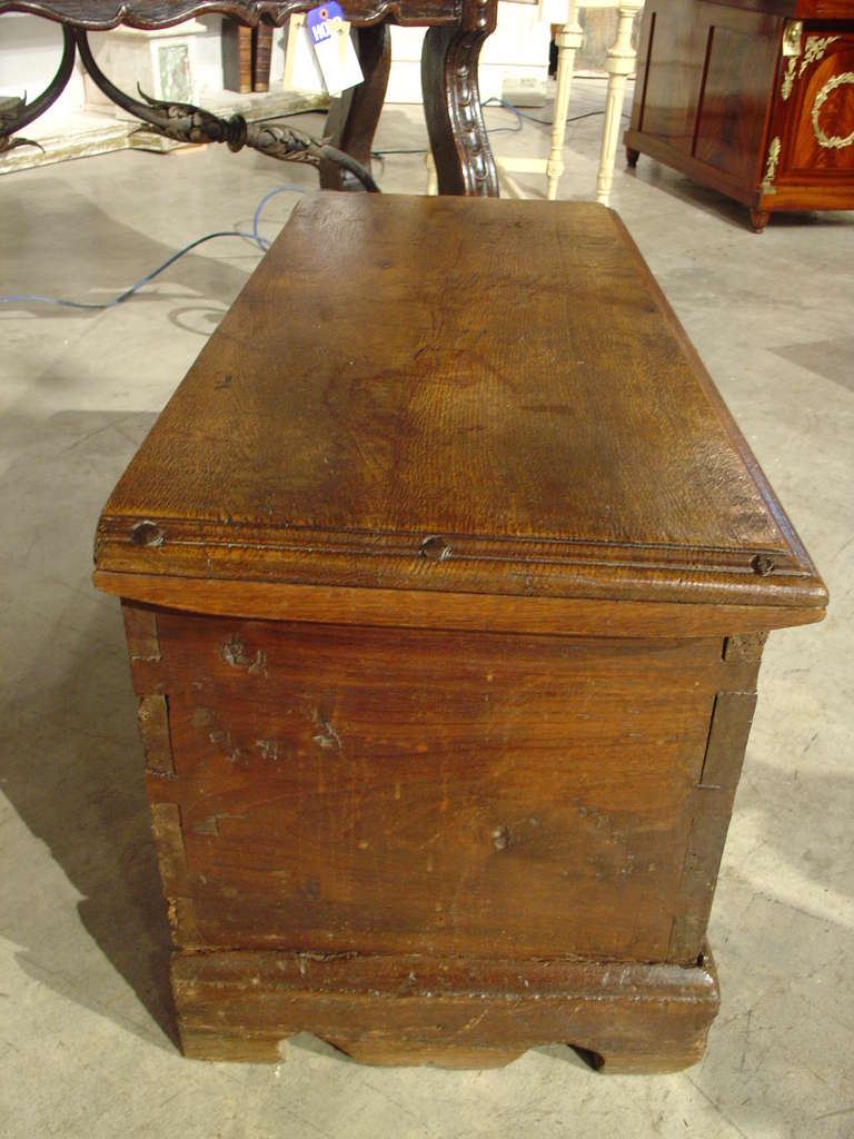 This well carved trunk originates from France, around 150 years ago and shows Gothic carvings and some foliate motifs to the front.  Solid and well built with dovetail construction, this antique piece shows its age with a beautiful patina and